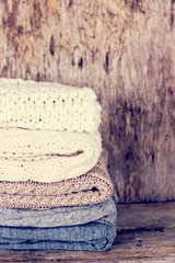 A stack of woolen sweater, plaid