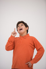 Cute school kid posing in studio with different facial expressio