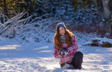 teen girl playing in snow