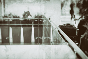 Sepia toned railing on train station