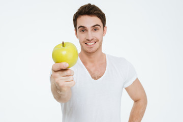 Happy man holding apple.