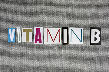 vitamin B on grey background, medical concept