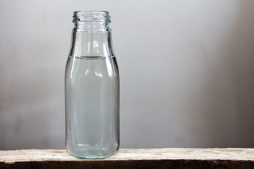 Drinking water in bottles on a wooden floor.