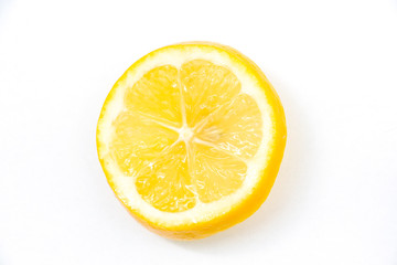 Juicy yellow slice of lemon on a white background isolated