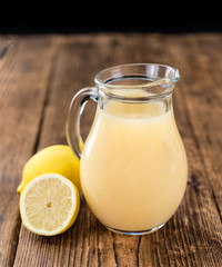 Fresh made Lemon Juice on a rustic background