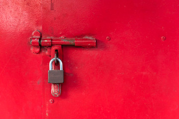 vintage door lock on red metal door