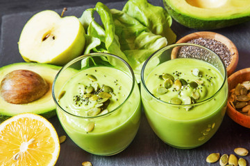 Fresh detox green smoothie with avocado, kiwi, salad with pumpki