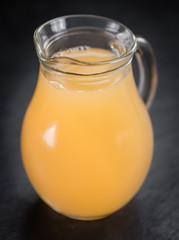Some Apple Juice on a dark slate slab