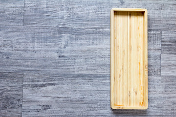 Obraz na płótnie Canvas Top view of empty wooden square tray background