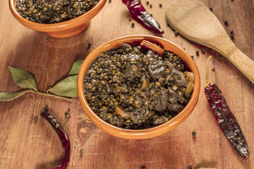 Lentil stew, shot with bay leaves and chili peppers