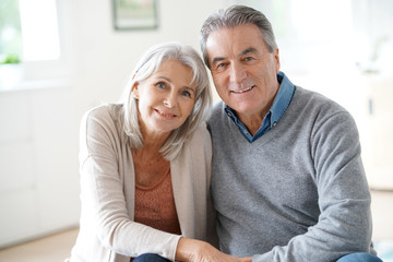 Portrait of senior couple relaxing in sofa