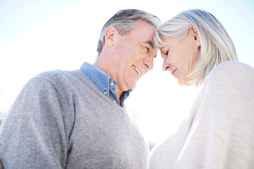 Portrait of senior couple embracing each other