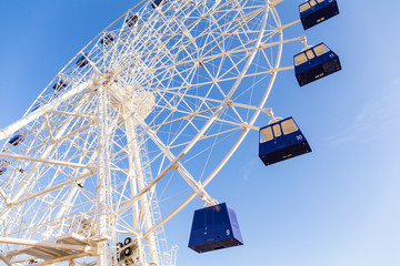Ferris wheel under blue sky