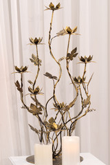 The gourd-shaped altar candles gold.