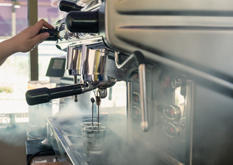 Coffee maker large machine pouring on cup