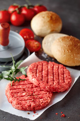 Raw Beef Hamburger Patties with Press and Rolls