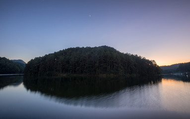 Viewpoint mountain reflection on reservoir at sunset