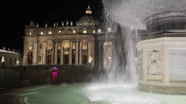 The so-called ancient fountain is one of two twin fountains placed in St. Peter's Square at the Vatican. The background, the facade and the colonnade of the temple basilica in Christendom.