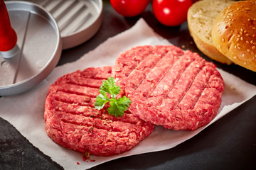 Raw Hamburger Patties Topped with Fresh Parsley