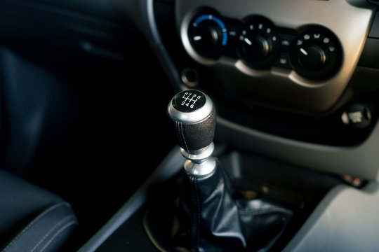 car drive concept : manual transmission in car - gearstick, manual gear shift knob.