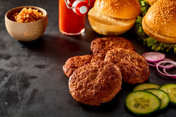 Cooked Burger Patties, Toppings and Sesame Buns