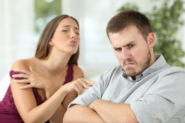 Angry man rejecting a sex offer from his girlfriend