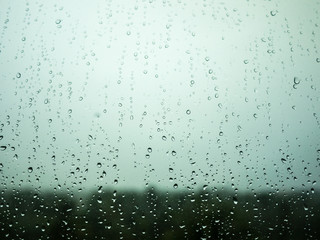 Naklejka na ściany i meble raindrops on window glass, background