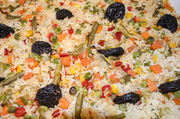 baked in the oven rice with vegetables and prunes

