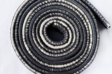 Naklejka premium worn black belt in martial arts