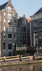 Fototapeta premium Netherlands, Amsterdam. Types of cities, buildings, canals and boats. Views on the water background. Amsterdam in the spring.