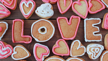 background with heart shape and word love valentine homemade cookies