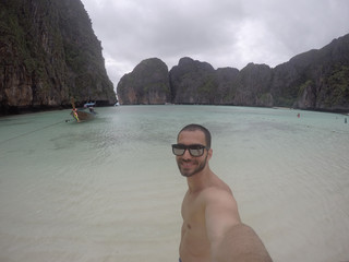 Man taking a selfie on the beach in Thailand