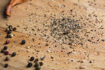 In the kitchen chopping board ground pepper and peas