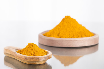 Turmeric powder on white background - Curcuma longa