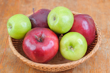 Top view of basket full of red and green apples
