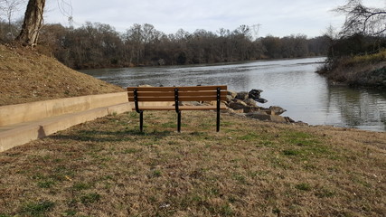 Bench overlooking rocks in the river