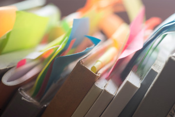 books and notebooks with multicolored stickers