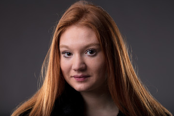 red haired woman on a black fur coat