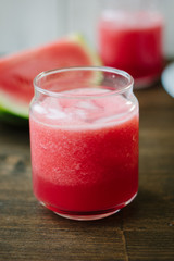 Delicious watermelon smoothie on the wooden board. Smoothie - vegetarian coctail from fresh fruit - watermelon