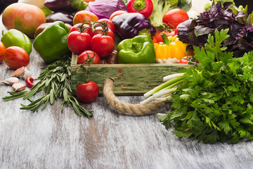 Set of different vegetables in the wooden tray