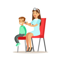 Boy On Medical Check-Up With Female Pediatrician Doctor Checking His Ears Doing Physical Examination For The Pre-School Health Inspection