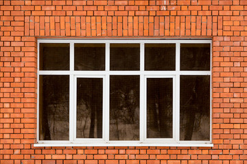 The window in the wall of red brick