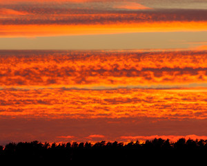Obraz premium Fiery red sunset clouds