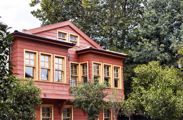 Fototapeta na wymiar Traditional, historical, old building by Bosphours in Istanbul. Architectural details shows the style dated in 19th century. Historic neighbourhood famous for its wooden Ottoman mansions