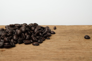 Old coffee bean on wooden with copy space