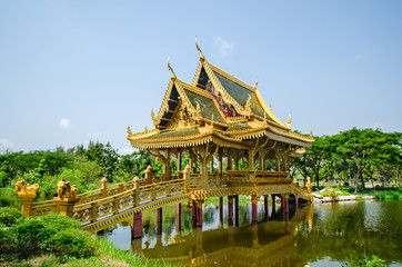Fototapeta na wymiar Thai Royal gold temple in the middle of the lake