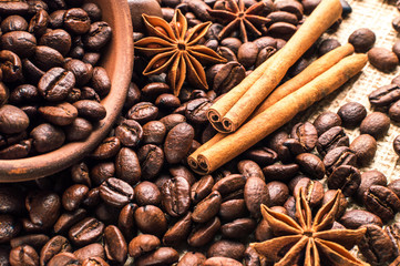 Coffee beans into bowl with cinnamon and anise