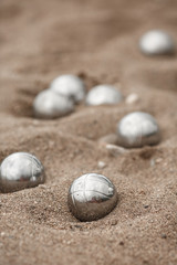 Fototapeta na wymiar Bocce petanque balls on sand beach