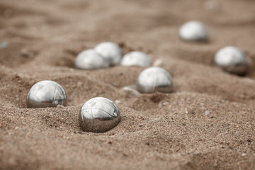Bocce petanque balls on sand beach