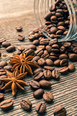 Coffee beans into glass jar table with sugar and anise